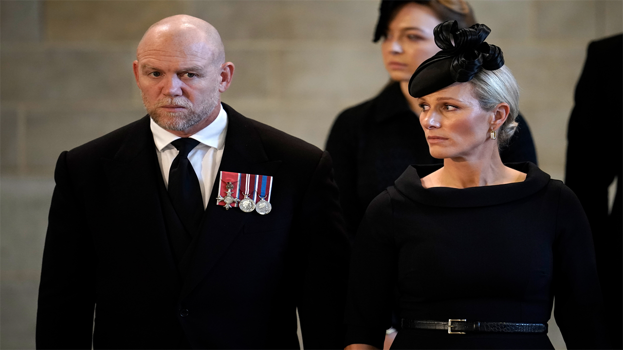 Mike Tindall spotted being told off for breaking silence during the Queen’s procession when Zara ‘shot him a look’