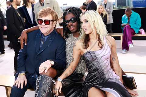 Lil Nas X Cozies Up to Elton John, Miley Cyrus & More at Star-Studded Versace Show