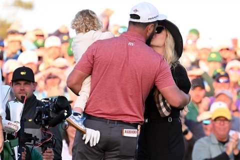 Jon Rahm kisses wife Kelley Cahill after winning his first Masters