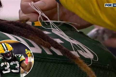 Aaron Jones’ jersey sewn together after falling apart during monster first half vs. Cowboys