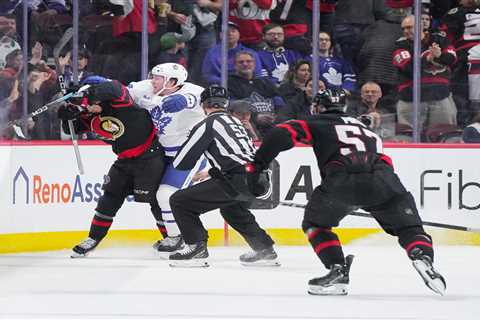 Maple Leafs’ Morgan Rielly cross checks Ridly Greig in face after empty net slap shot