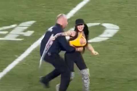 Woman runs onto field waving pro-Trump sign during Jets-Steelers game