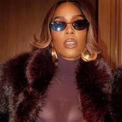 Kelly Rowland Wore a Burgundy ‘Sons of Gemini’ Dress and a $1,490 Retrofete Faux Fur Coat to..