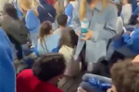 UCLA fan smacks USC fan in the face during rivalry football game in vicious scene