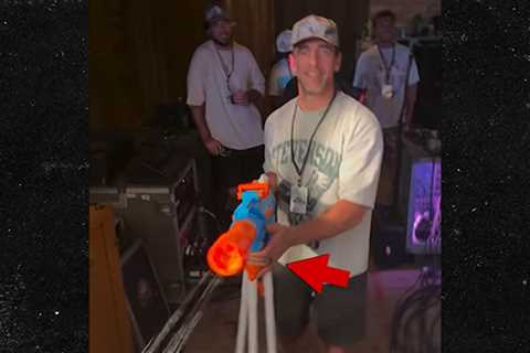 Aaron Rodgers Sports Ring On Wedding Finger, Shoots Water Gun At Mike. Concert