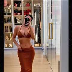 Kim Kardashian Models Skimpy Bikinis in Lavish Bedroom