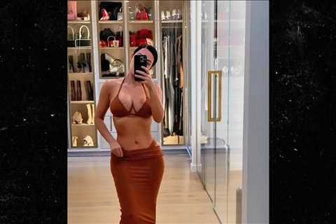 Kim Kardashian Models Skimpy Bikinis in Lavish Bedroom