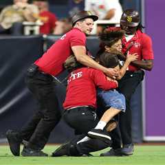Young kid tackled by Padres security after invading field — and fans were not happy