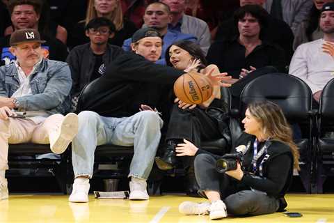 NFL star Justin Herbert saves pop star girlfriend Madison Beer from flying basketball at Lakers game