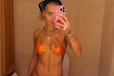 Guess the Sexy Singer Rockin' This Orange Bikini!