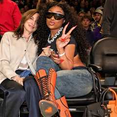 Megan Thee Stallion Courtside in Orange Lace-Up Heels and a Black-and-Feu Hermès Casaque HAC Bag at ..