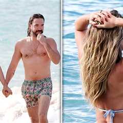 Heidi Klum Flaunts Curves in Tiny Baby Blue Bikini