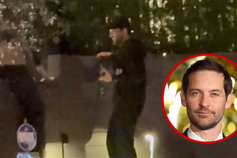 Tobey Maguire Scales Wall With Beer in Hand While Out With Mystery Girl, on Video