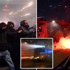 Hundreds of hooded protesters throw fireworks, clash with police after Winter Olympics Opening..
