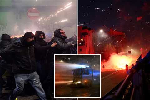 Hundreds of hooded protesters throw fireworks, clash with police after Winter Olympics Opening..