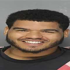 Ex-Dallas Cowboy Trysten Hill grins after arrest for allegedly assaulting pregnant woman