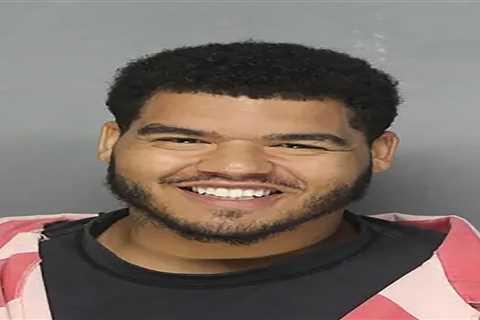 Ex-Dallas Cowboy Trysten Hill grins after arrest for allegedly assaulting pregnant woman