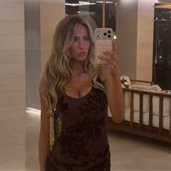 Alix Earle Flashes Cleavage in Tight Black Dress in Ibiza