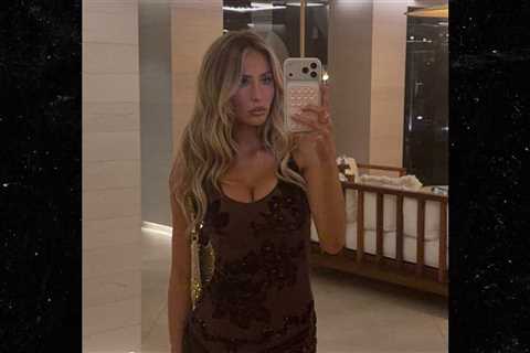 Alix Earle Flashes Cleavage in Tight Black Dress in Ibiza