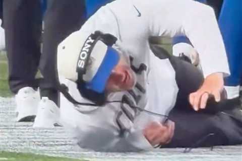 Colts coach gets knocked down by own player in painful sideline moment